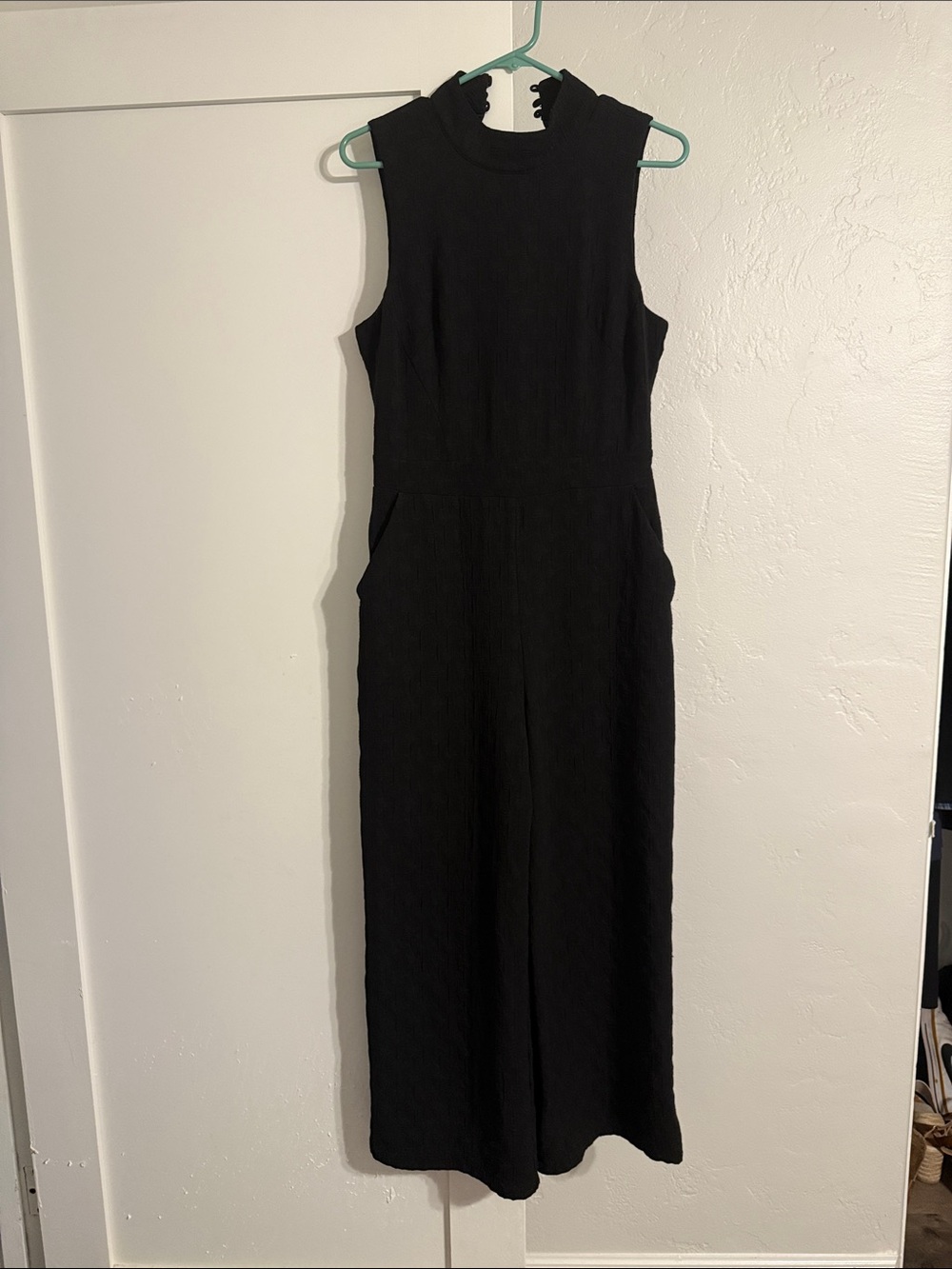 Eva Franco Anthropologie black jumper with open back